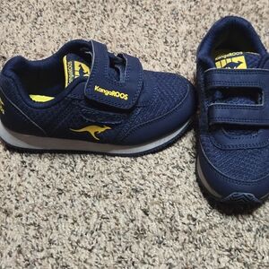 *Size 10* Kangaroos* Navy Blue and Yellow* Velcro Strap and Small Pocket*
